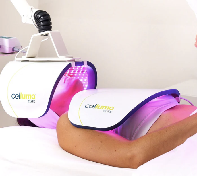 Client receiving Celluma LED light therapy facial treatment at Spa La La in Austin