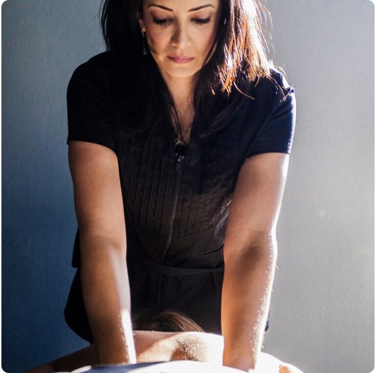Female therapist providing massage therapy at Spa La La in Austin