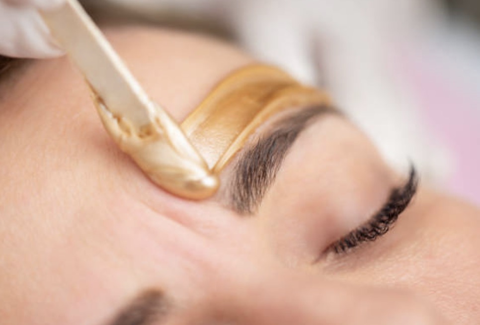 A client receiving a professional Brow Wax treatment at Spa La La Aesthetics & Wellness in Austin